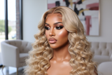 Realistic model wearing 24” 613 13x4 deep wave lace unit with beat face and plump lips